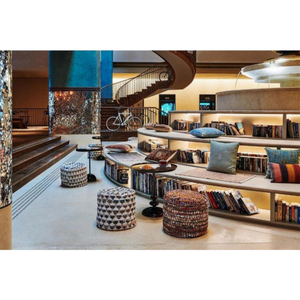 Vintage Ethnic B&B Lobby Lounge Custom Furnishings Curved Open Bookcases Hand-Woven Stools Integrated Fabric Cushion System