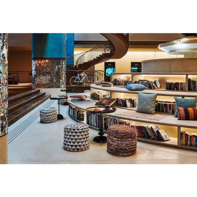 Vintage Ethnic B&B Lobby Lounge Custom Furnishings Curved Open Bookcases Hand-Woven Stools Integrated Fabric Cushion System
